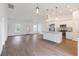 Bright living room showcases an open floorplan, modern fixtures, and hard surface flooring at 14404 Sw 19Th Pl, Ocala, FL 34481