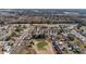 Wide aerial view of a residential community adjacent to a lush golf course at 1921 Nw 50Th Cir, Ocala, FL 34482