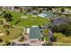 Community aerial showcasing the clubhouse, shuffleboard, pool, parking, and golf course at 1921 Nw 50Th Cir, Ocala, FL 34482