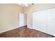 A bedroom featuring neutral decor, hardwood floors, and a closet at 1921 Nw 50Th Cir, Ocala, FL 34482