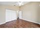 Bright bedroom with hardwood floors, ceiling fan, and a closet for ample storage at 1921 Nw 50Th Cir, Ocala, FL 34482