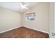 This bedroom features a ceiling fan and a bright window at 1921 Nw 50Th Cir, Ocala, FL 34482