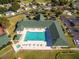 Aerial view of a community clubhouse, pool and tennis courts at 1921 Nw 50Th Cir, Ocala, FL 34482