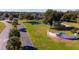 Community entrance sign, lush landscaping, pond, and a glimpse of the scenic surroundings at 1921 Nw 50Th Cir, Ocala, FL 34482