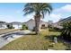 Inviting single-story home featuring a lush front lawn and an attached two-car garage at 1921 Nw 50Th Cir, Ocala, FL 34482