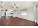 Bright living room with a ceiling fan and open floor plan leading to the kitchen at 1921 Nw 50Th Cir, Ocala, FL 34482