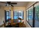 Cozy dining room with an open view of the screened-in pool providing a tranquil eating experience at 20260 Sw 95Th St, Dunnellon, FL 34431