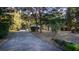 View of a long driveway leading up to a well-maintained home at 20260 Sw 95Th St, Dunnellon, FL 34431