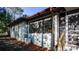 Exterior view of the home's side showcasing updated windows and a neutral color palette at 20260 Sw 95Th St, Dunnellon, FL 34431