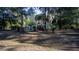 A home surrounded by mature trees and well-maintained landscaping at 20260 Sw 95Th St, Dunnellon, FL 34431