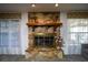 Living room featuring a floor-to-ceiling stone fireplace and hearth at 20260 Sw 95Th St, Dunnellon, FL 34431