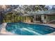 Inviting screened-in pool area, perfect for relaxation and outdoor enjoyment with room for seating at 20260 Sw 95Th St, Dunnellon, FL 34431