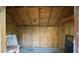 Interior shot of a shed featuring wood plank walls, shelving and storage at 20260 Sw 95Th St, Dunnellon, FL 34431