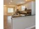 A modern kitchen featuring white cabinets and a breakfast bar with granite countertops at 2259 Nw 2Nd Ave, Ocala, FL 34475