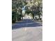 Scenic street view with yellow lines, trees and a residential neighborhood at 2259 Nw 2Nd Ave, Ocala, FL 34475