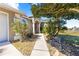 Inviting front entrance walkway with lovely landscaping and views of the house at 2310 Nw 59Th Ave, Ocala, FL 34482