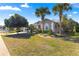 Charming single-story home featuring mature landscaping, a two-car garage, and great curb appeal at 2310 Nw 59Th Ave, Ocala, FL 34482