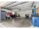 Spacious garage with ample storage space, workbench, and overhead lighting at 2310 Nw 59Th Ave, Ocala, FL 34482