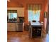 Kitchen features a dining nook, granite countertops, stainless steel appliances, and tile flooring at 2310 Nw 59Th Ave, Ocala, FL 34482