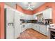 Charming kitchen featuring white cabinets, tile backsplash, and modern appliances at 2310 Nw 59Th Ave, Ocala, FL 34482