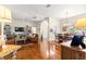 Bright and open living room with hardwood floors flowing into the dining area, perfect for entertaining at 2310 Nw 59Th Ave, Ocala, FL 34482