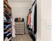 Organized walk-in closet with shelving, hanging racks, and ample storage at 2310 Nw 59Th Ave, Ocala, FL 34482