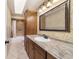 Bathroom featuring a tub shower, vanity and granite countertop at 2620 Sw 152Nd Ln, Ocala, FL 34473