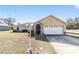 Charming single-story home with well-maintained lawn, garage and stone accents at 2620 Sw 152Nd Ln, Ocala, FL 34473