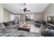 Living room showcasing comfortable seating, ceiling fan, and natural light at 2620 Sw 152Nd Ln, Ocala, FL 34473