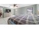 Spacious bedroom featuring tile floors, a ceiling fan, and plenty of natural light at 2620 Sw 152Nd Ln, Ocala, FL 34473