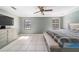 Large bedroom with tile flooring, two windows, ceiling fan, and neutral paint at 2620 Sw 152Nd Ln, Ocala, FL 34473