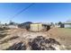 View of the screened in pool area in the backyard with an outbuilding and partial fencing at 2620 Sw 152Nd Ln, Ocala, FL 34473