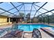 Inviting in-ground pool and spa area enclosed with a screen, offering privacy and outdoor enjoyment at 2620 Sw 152Nd Ln, Ocala, FL 34473