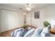 Bedroom with hardwood floors, closet, and neutral decor creates a peaceful and inviting space at 3001 Rugby Way, The Villages, FL 32162