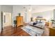 Well-lit main bedroom featuring hardwood floors and a king size bed at 3001 Rugby Way, The Villages, FL 32162