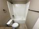 Bright bathroom featuring a shower-tub combination with white tile and sleek black fixtures at 3044 Sw 168Th Loop, Ocala, FL 34473