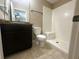 Bright bathroom featuring a vanity with a granite countertop and walk-in shower at 3044 Sw 168Th Loop, Ocala, FL 34473