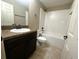 Modern bathroom featuring a vanity with a granite countertop and a shower-tub combination at 3044 Sw 168Th Loop, Ocala, FL 34473