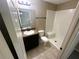 Well-lit bathroom featuring a modern vanity with a granite countertop and a white tiled shower stall at 3044 Sw 168Th Loop, Ocala, FL 34473