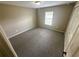 Comfortable bedroom with neutral carpet, a window with blinds, and a closet for storage at 3044 Sw 168Th Loop, Ocala, FL 34473