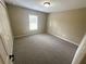 Bright bedroom with neutral carpet, a window with blinds, and a closet for optimal storage at 3044 Sw 168Th Loop, Ocala, FL 34473