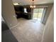 Corner view of the open kitchen with backyard access and stainless steel sink at 3044 Sw 168Th Loop, Ocala, FL 34473