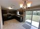 Open kitchen with modern dark cabinets and sliding glass doors to the backyard at 3044 Sw 168Th Loop, Ocala, FL 34473