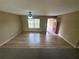 Inviting living room featuring hardwood floors, a ceiling fan, and a bright interior at 3044 Sw 168Th Loop, Ocala, FL 34473