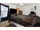 Bedroom featuring neutral walls, carpet, a black television, and a window with dark curtains at 3994 Sw 102Nd Pl, Ocala, FL 34476