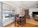 Dining area featuring a large window, wood floors, and views to the backyard at 3994 Sw 102Nd Pl, Ocala, FL 34476