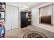 Pantry storage room with shelving, black refrigerator, neutral carpet, and a window at 3994 Sw 102Nd Pl, Ocala, FL 34476