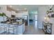 Open kitchen featuring an island with seating and modern appliances at 4050 Nw 44Th Cir, Ocala, FL 34482