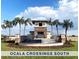 Ocala Crossings South community entrance with lush palm trees and a water feature at 4739 Sw 88Th Ln, Ocala, FL 34476