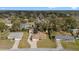 An aerial view of the neighborhood showing single-Gathering homes with mature trees and well-kept lawns at 4837 Ne 5Th Street Rd, Ocala, FL 34470